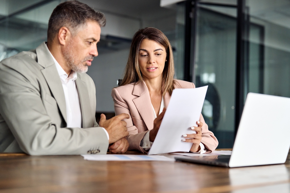 Team members reviewing contracts